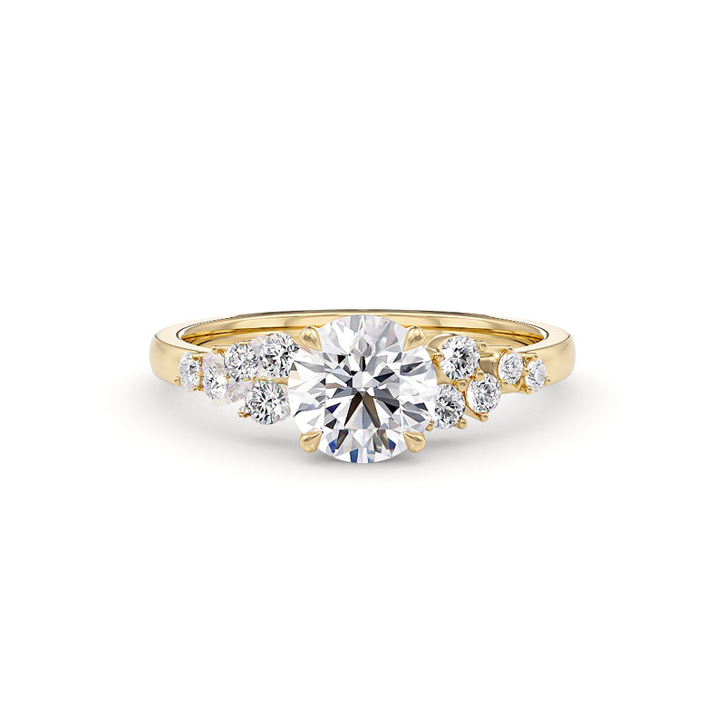 Cinderella engagement ring in yellow gold from Stellini Diamonds, featuring a delicate design and sparkling center stone.