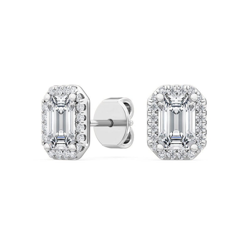 Stellini Diamonds Hallo Emerald Ohrringe featuring vibrant emerald stones set in elegant silver hoops.