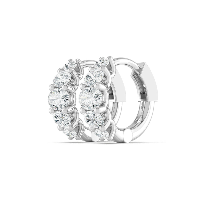 Oval diamond hoop earrings in white gold by Stellini Diamonds, showcasing a luxurious and elegant design.